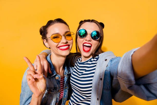 Two girls on yellow background