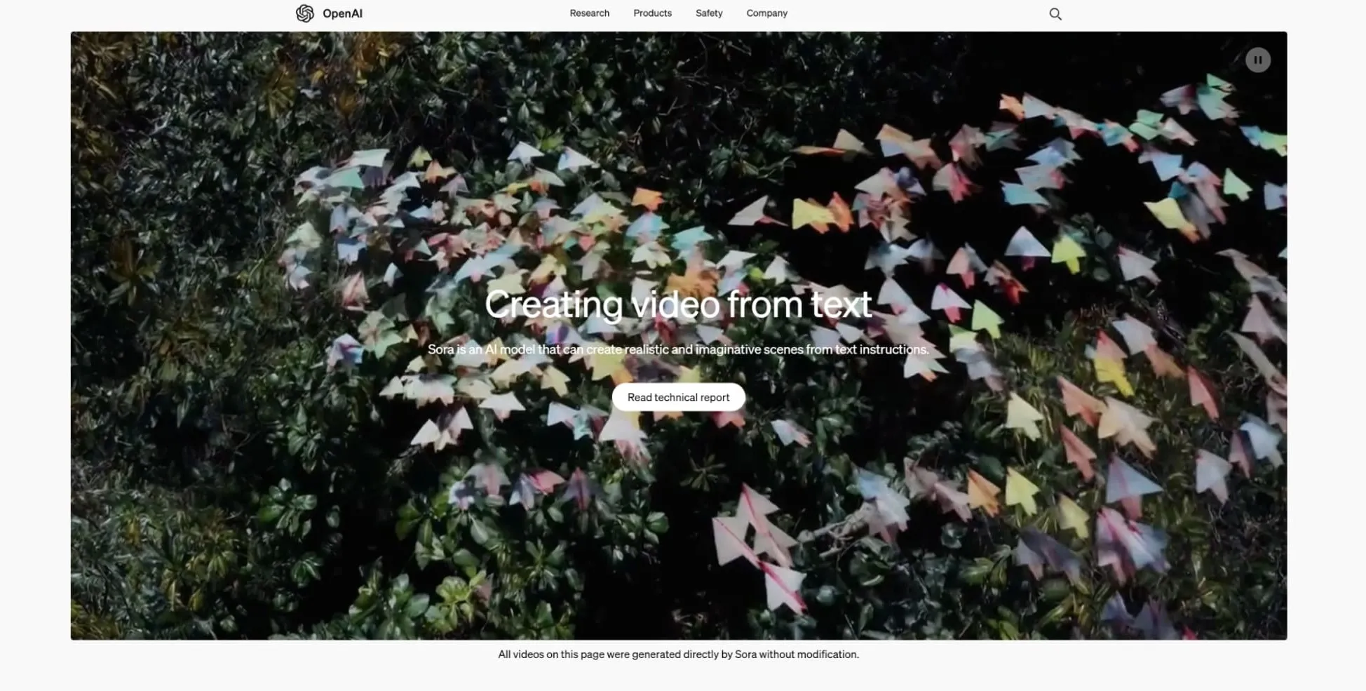 Colorful paper triangles scattered among green foliage.